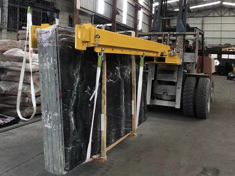 forklift boom to unload stone container